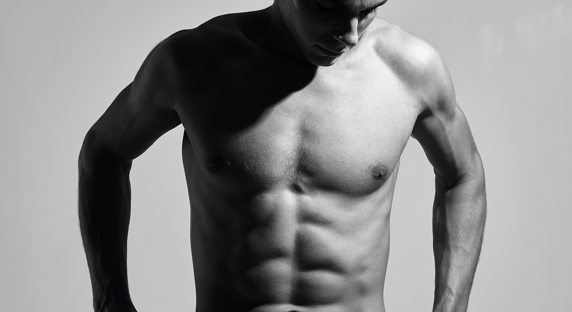 Black and white portrait of muscular man.