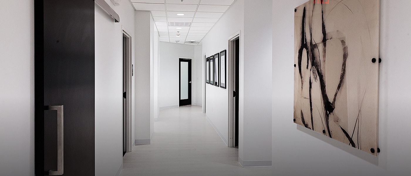 Woman in stylish outfit with dramatic lighting.