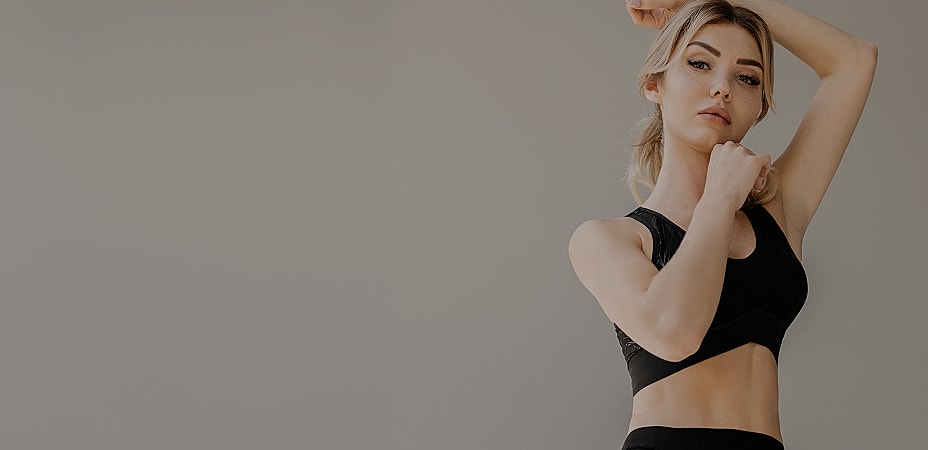 Woman in athletic wear posing gracefully.